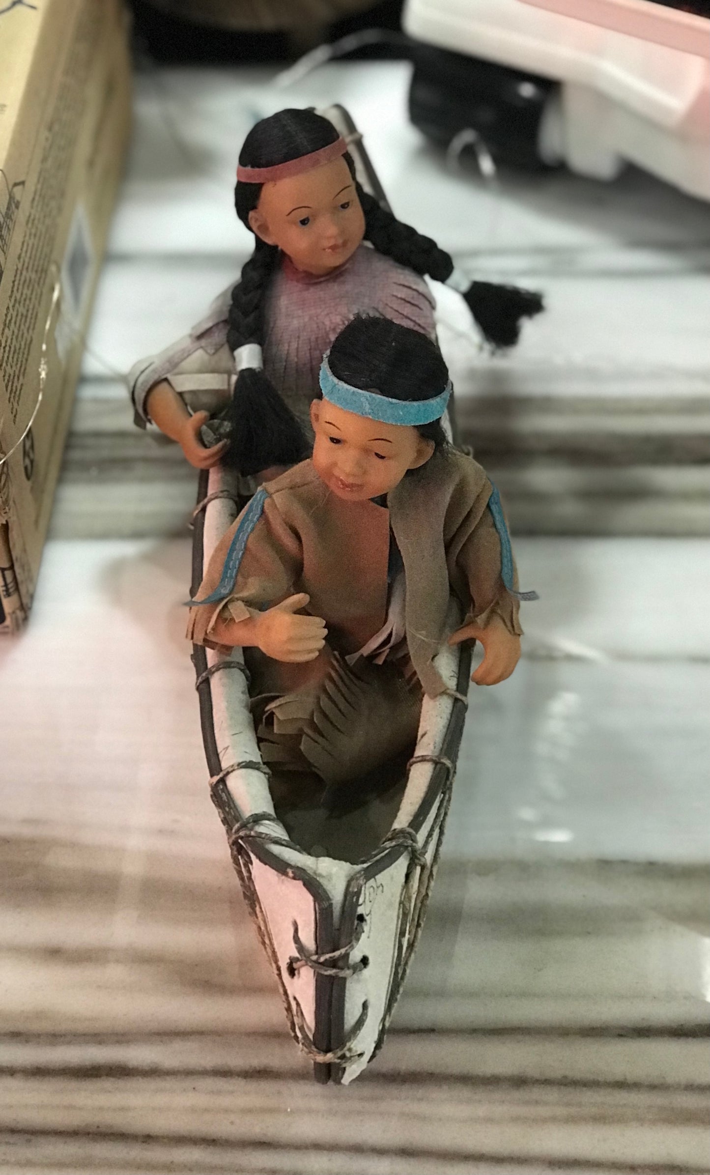 Native Americans In A Canoe